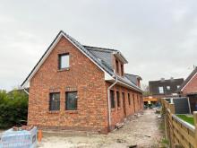 Esens - ruhige Innenstadt-Lage: Neubau Ferienwohnung im Erdgeschoss mit Terrasse Wohnung kaufen 26427 Esens Bild klein