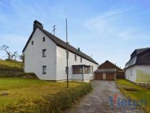 Hier wartet ein Einfamilienhaus mit Nebengebäude und Doppelgarage auf einen neuen Eigentümer Haus kaufen 53945 Blankenheim (Kreis Euskirchen) Bild klein