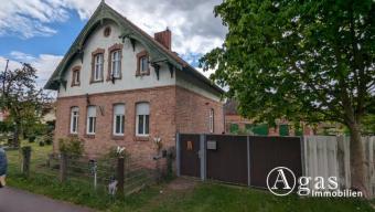 Vermietetes Einfamilienhaus mit Nebengebäude auf sehr großem Grundstück mit viel Baufläche Haus kaufen 14913 Niederer Fläming Bild mittel